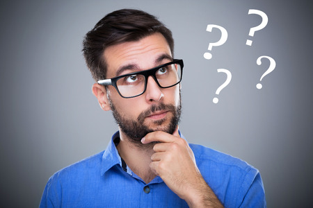 51244486 - man thinking with question marks